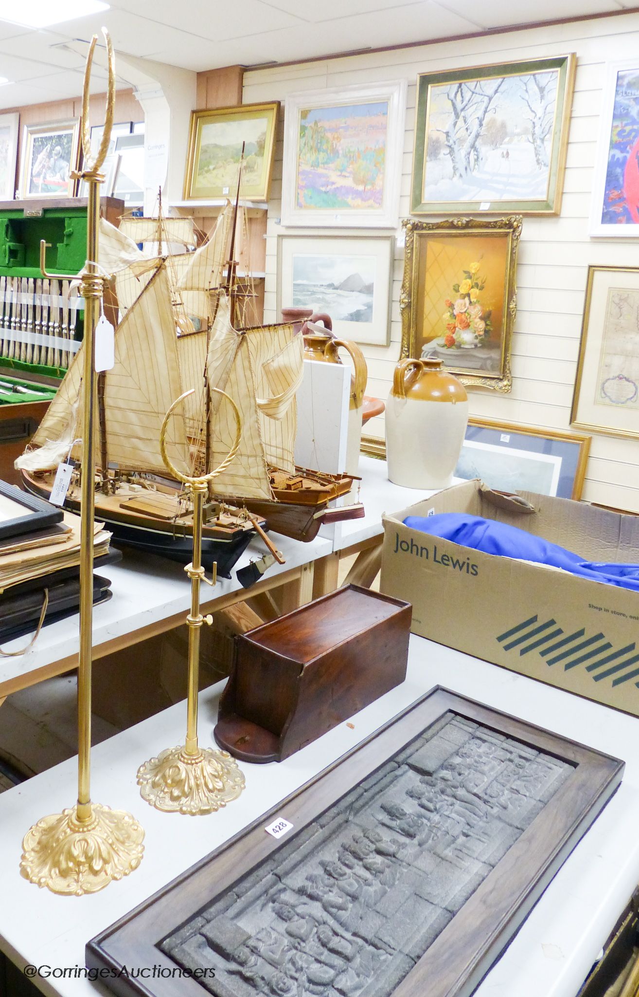A pair of gilt hat and scarf stands, a temple plaque and a salt box